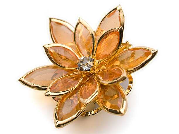 isolated flower broach ambercoloured on white background isolated flower broach ambercoloured on white background